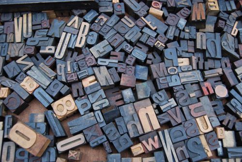 Random wooden blocks with letters